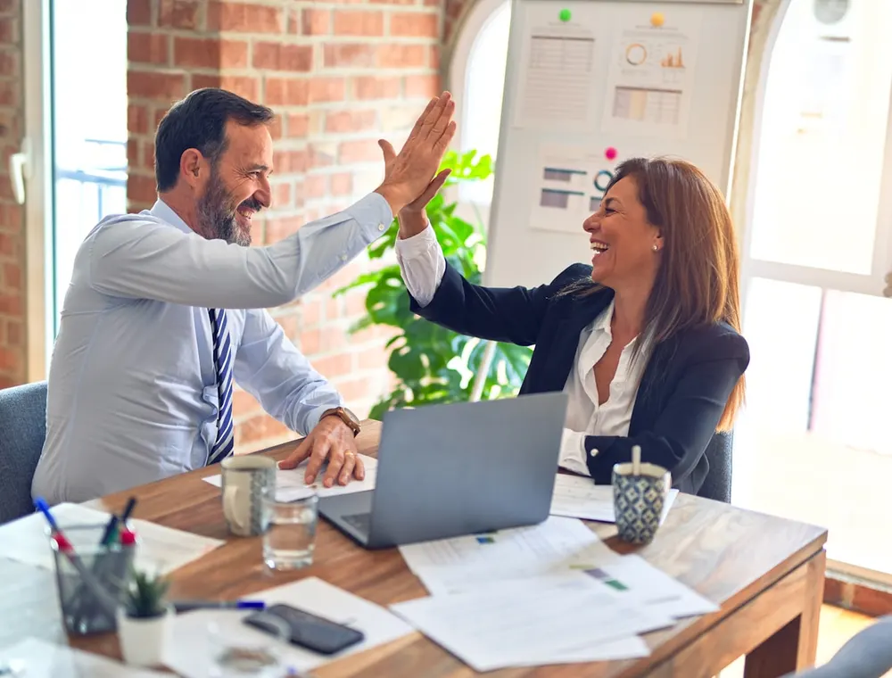 A financial advisor meeting a client, reviewing needs together